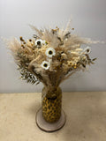 Bouquet sur mesure de Rêves En Fleurs avec fleurs colorées et feuillage, présenté dans une composition élégante.