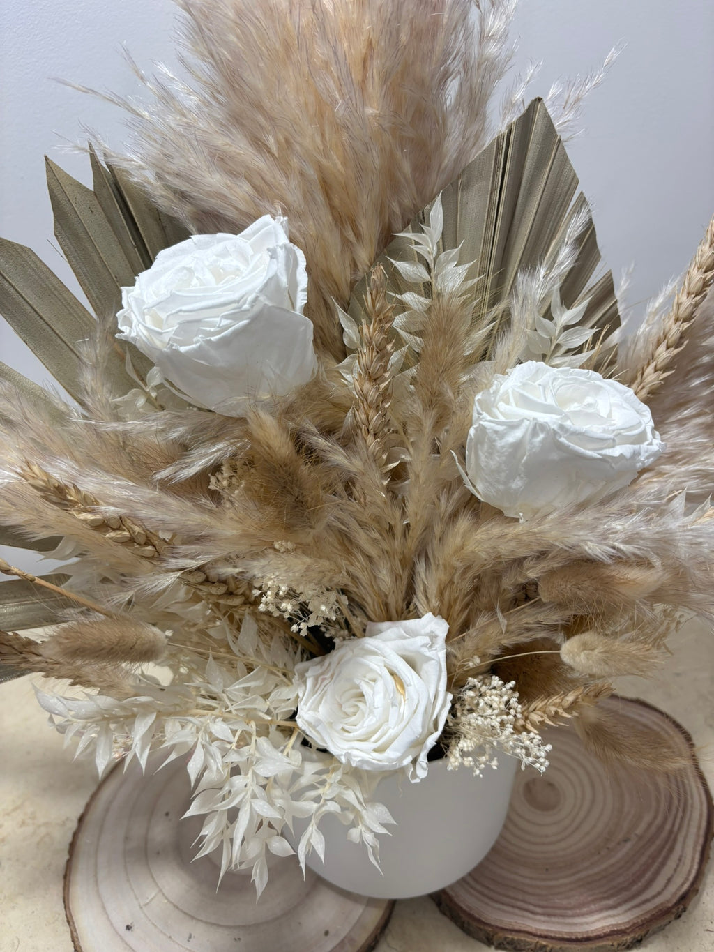 Composition en hauteur de Rêves En Fleurs avec diverses fleurs colorées dans un arrangement élégant.
